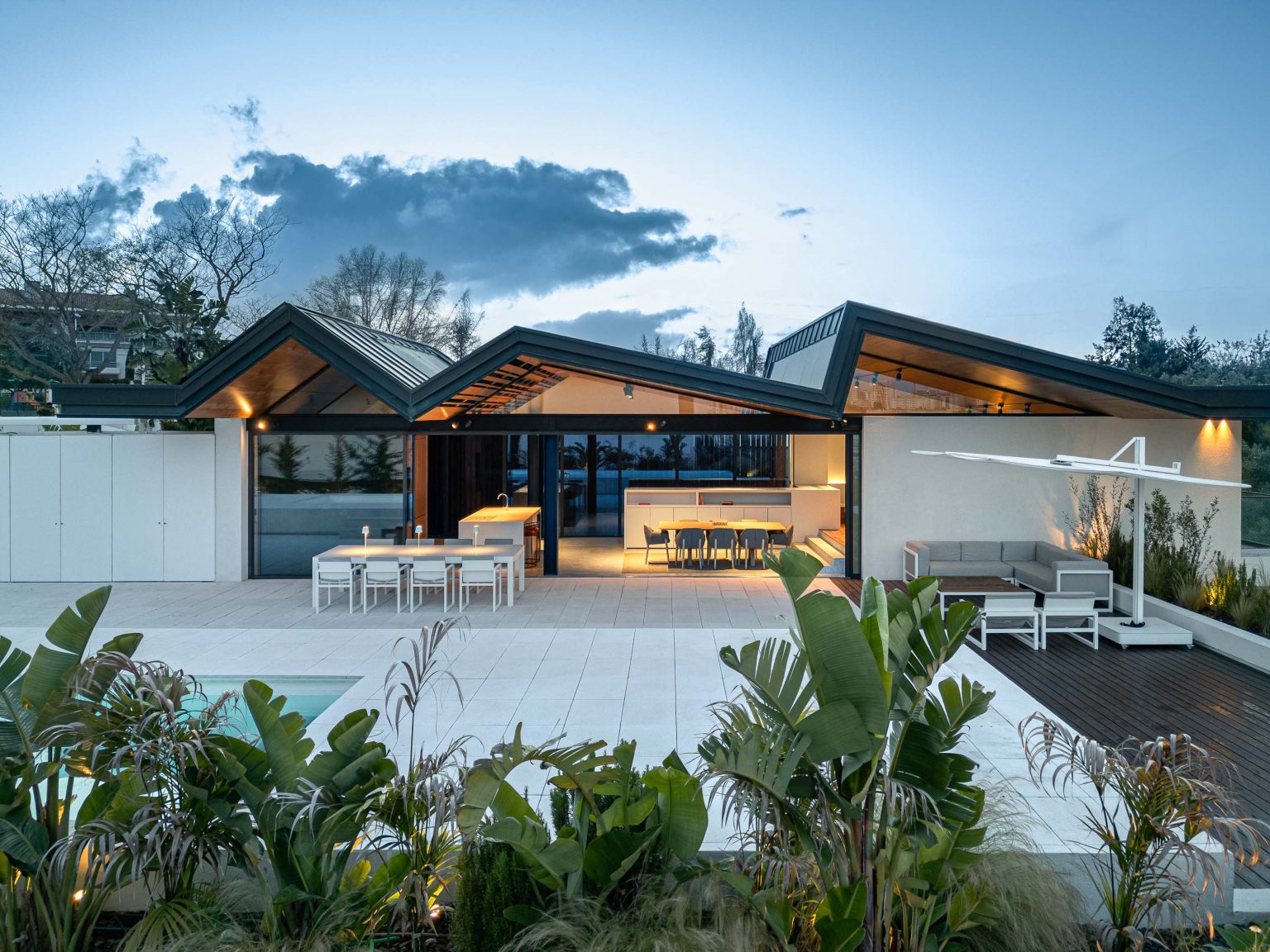 Golf Course Residence with Asymmetrical Gable Roof Design